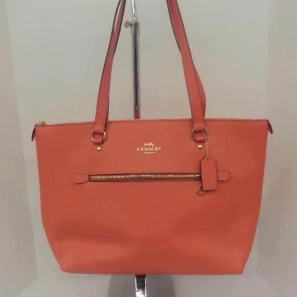 Larger coral coach tote with matching wallet